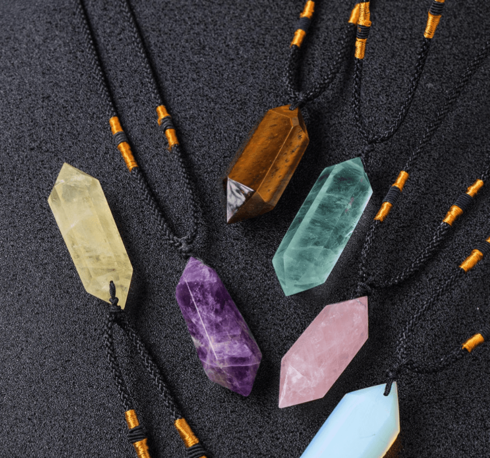 Assorted crystal pendants including the Dream Amethyst Crystal Pendant, featuring unique shapes and colors