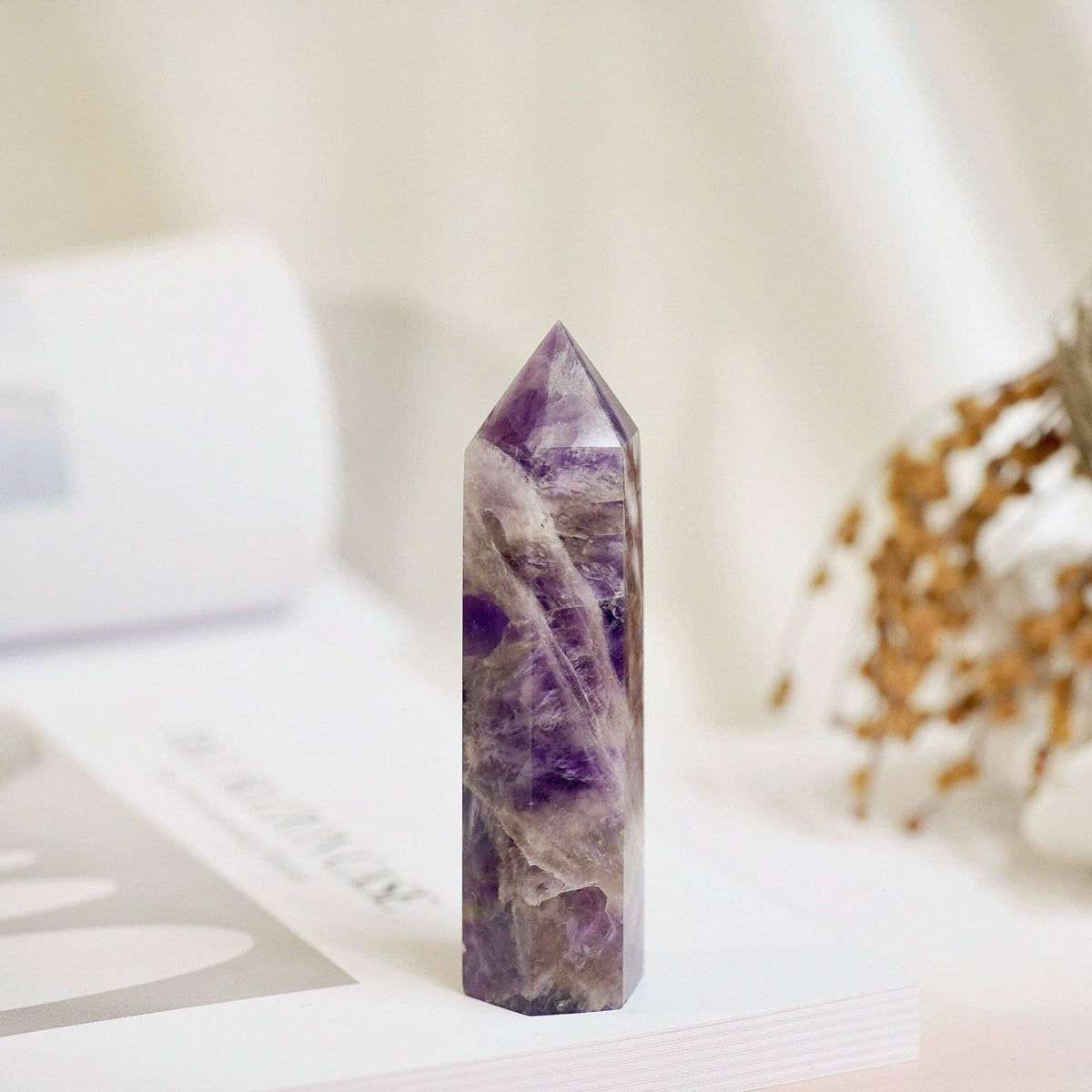Natural Dream Amethyst Tower featuring a polished purple crystal with unique patterns and angles