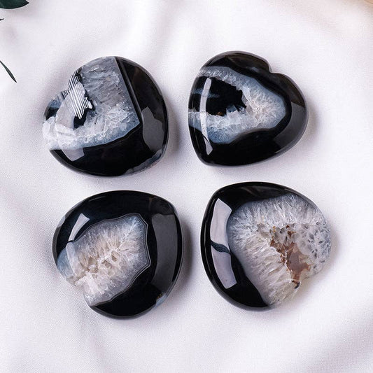 Set of four Black Agate Heart stones featuring unique natural patterns and smooth polished surfaces