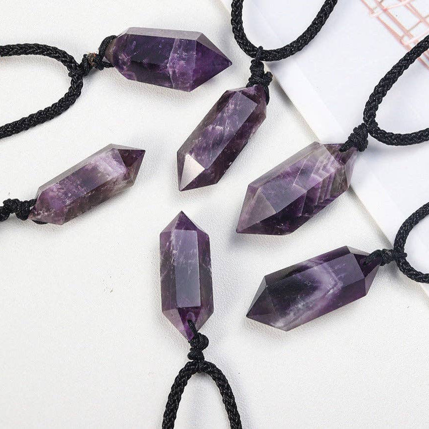 Dream Amethyst Crystal Pendant in various geometric shapes, hung on black cords for a mystical look