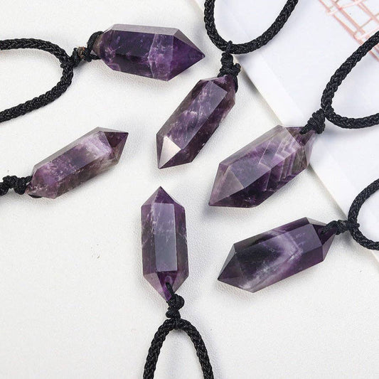 Dream Amethyst Crystal Pendant in various geometric shapes, hung on black cords for a mystical look