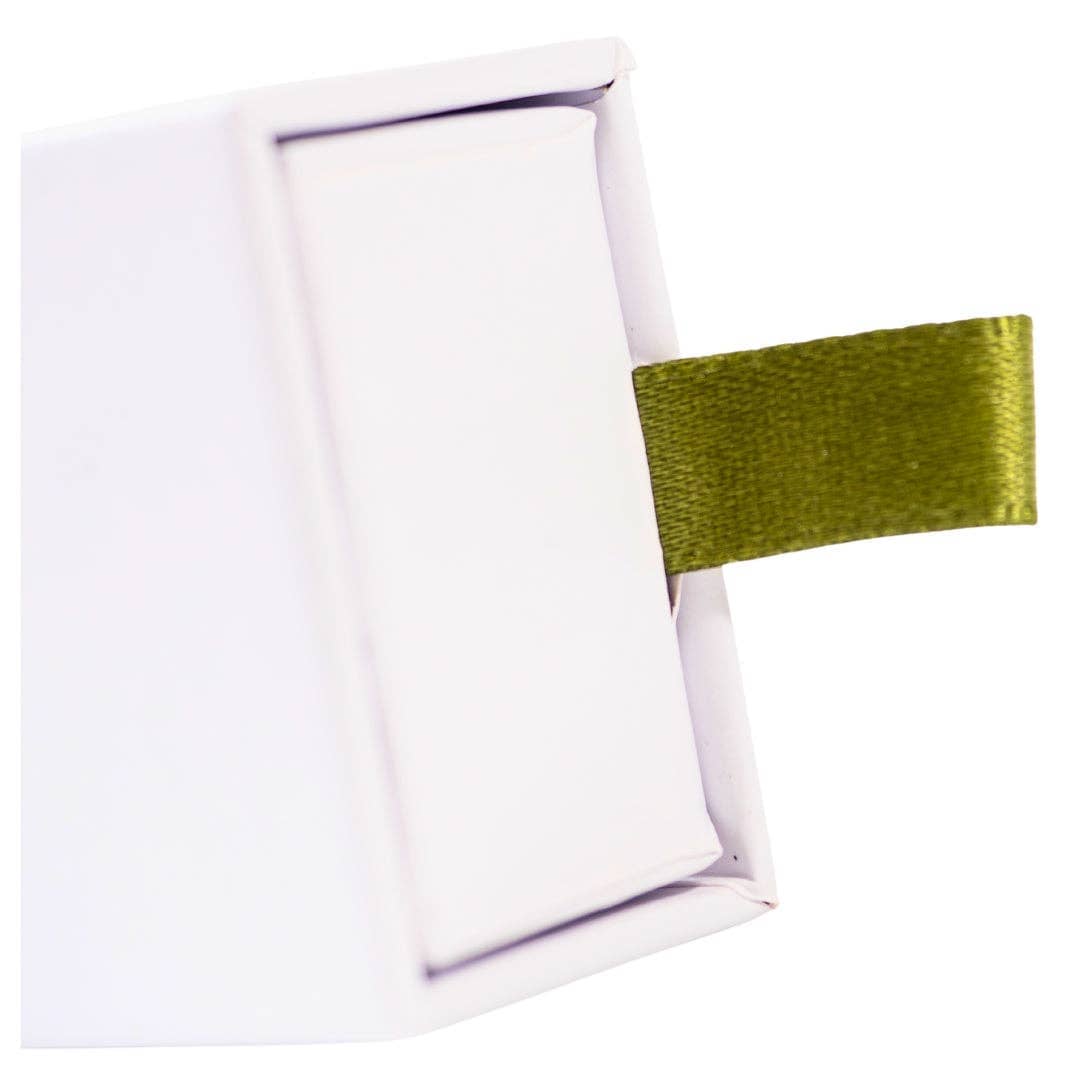 Exuro Incense Sticks box featuring a green ribbon for easy opening and storage