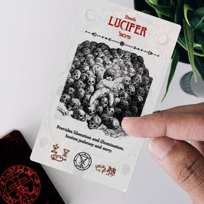Occult Tarot card featuring Lucifer artwork, showcasing skulls and detailed symbolism