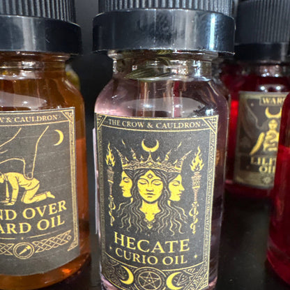 The Crow and Cauldron - 10ml Curio Oil - Hecate with a mystical design featuring three goddess faces