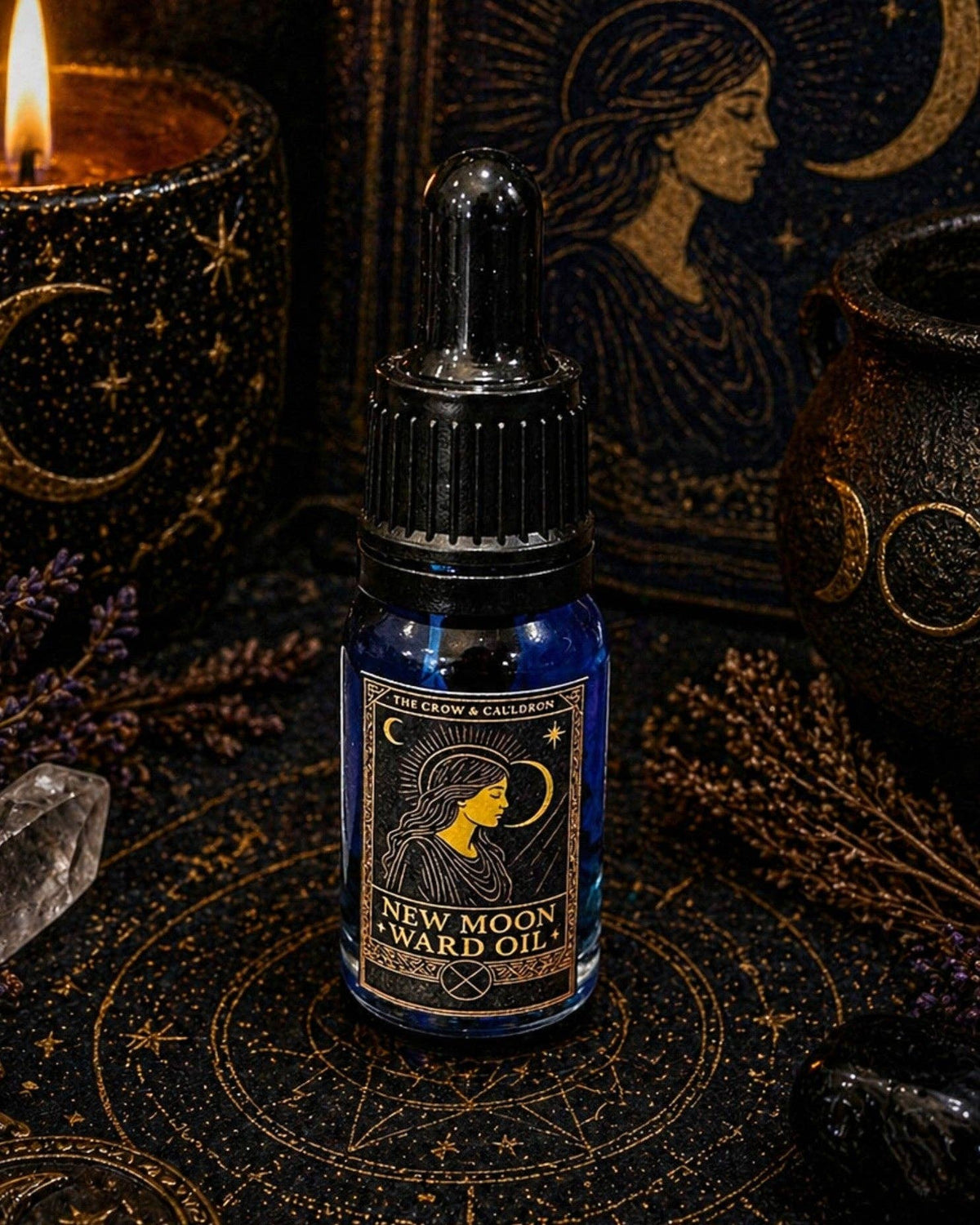 The Crow and Cauldron - 10ml Curio Oil - New Moon in a blue bottle surrounded by mystical decor