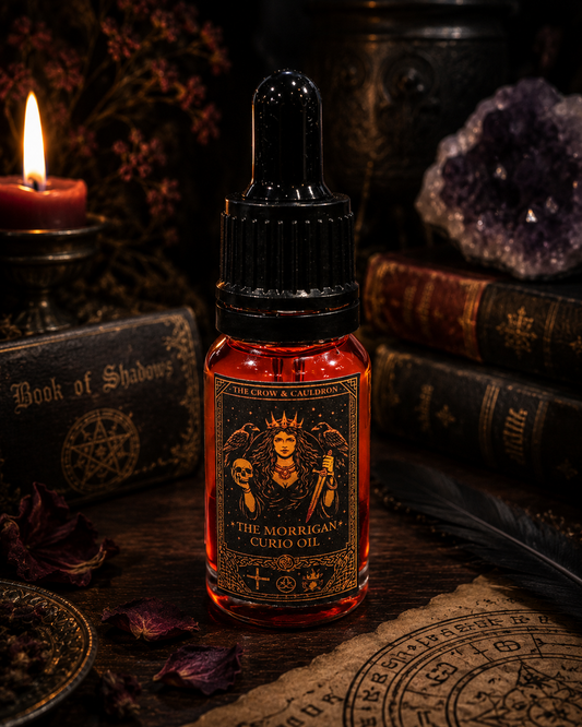 The Crow and Cauldron - 10 ml Curio Oil - The Morrigan in a decorative bottle, surrounded by mystical decor