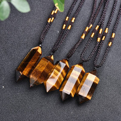 Tiger's Eye Crystal Pendant on braided cord, featuring unique facets and a natural finish.
